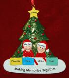 Couples Christmas Ornament in Front of Tree Personalized FREE at PersonalizedOrnamentsMarket.com by Russell Rhodes